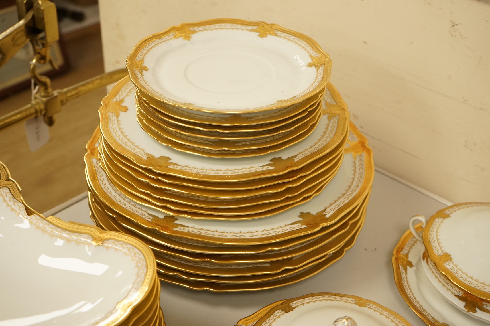 A Haviland Limoges dinner service with gilt border